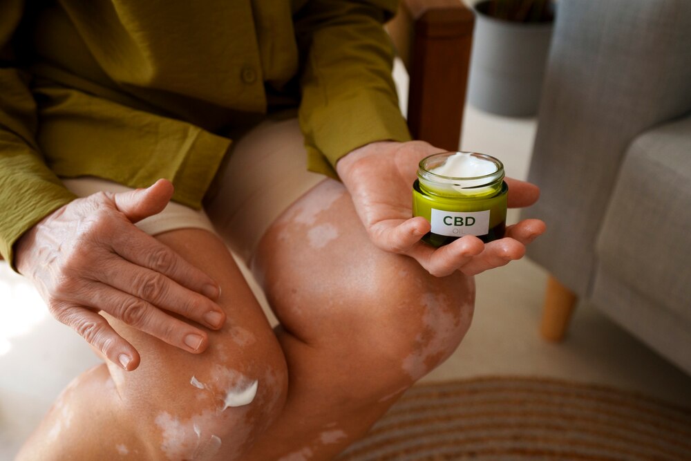 Close up on woman using cbd cream for pain